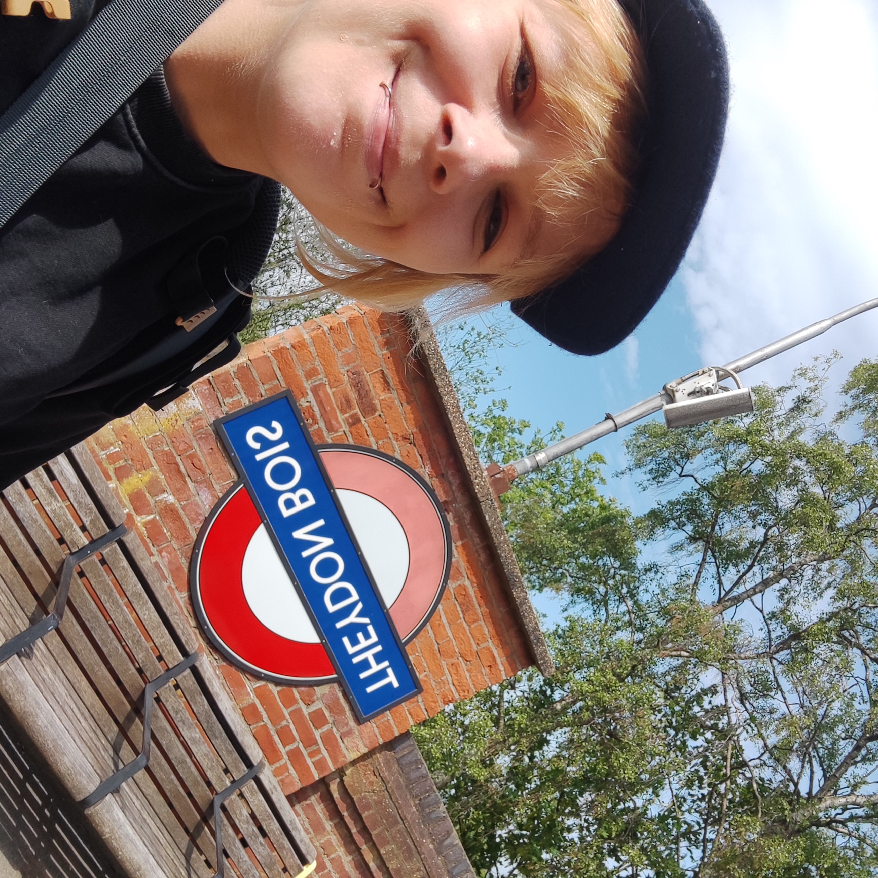 picture of Eva in front of TFL sign